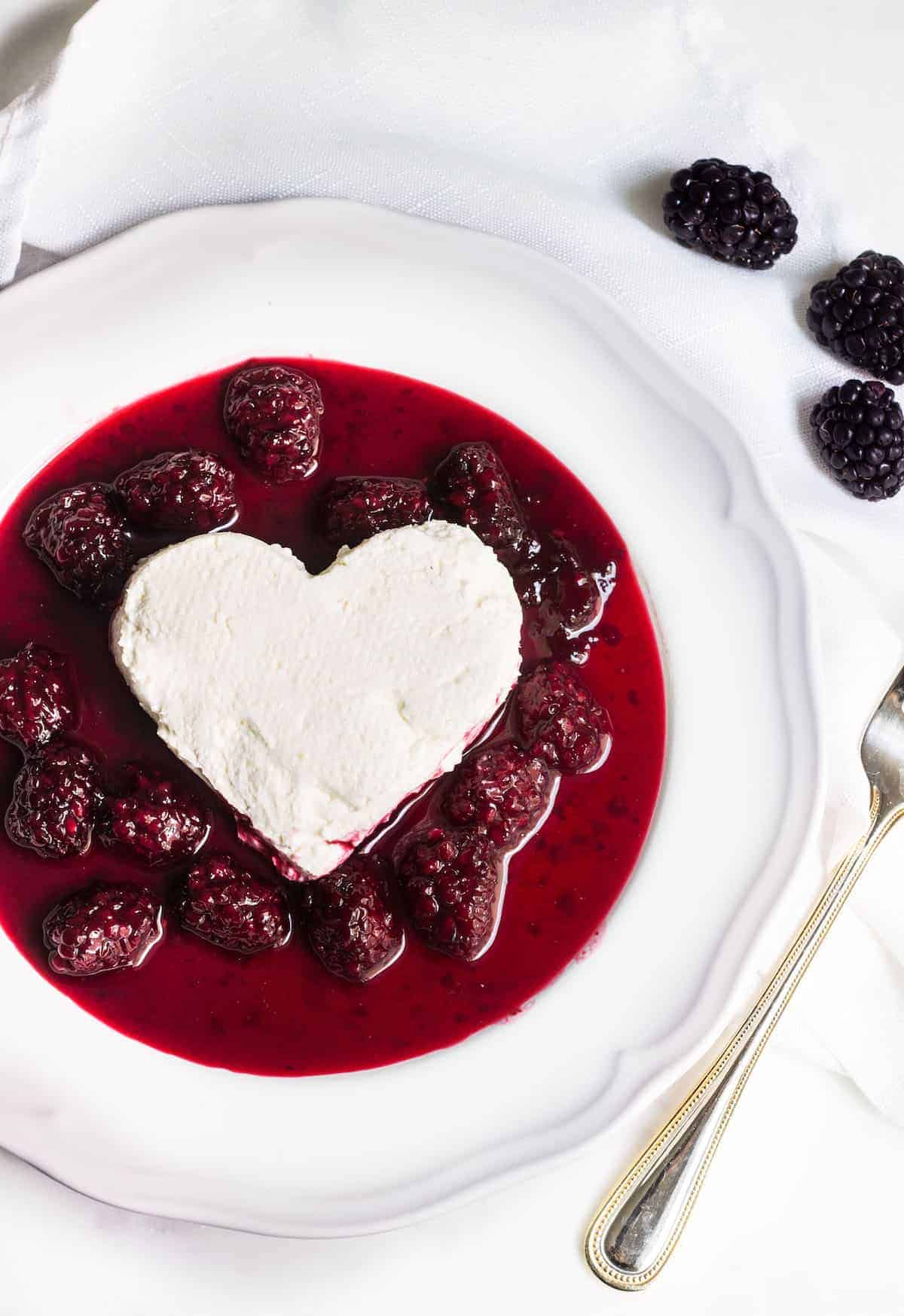 Coeur a la creme: A creamy, rich French dessert served with blackberry sauce. Perfect for Valentine's Day or special occasions! Recipe via MonPetitFour.com