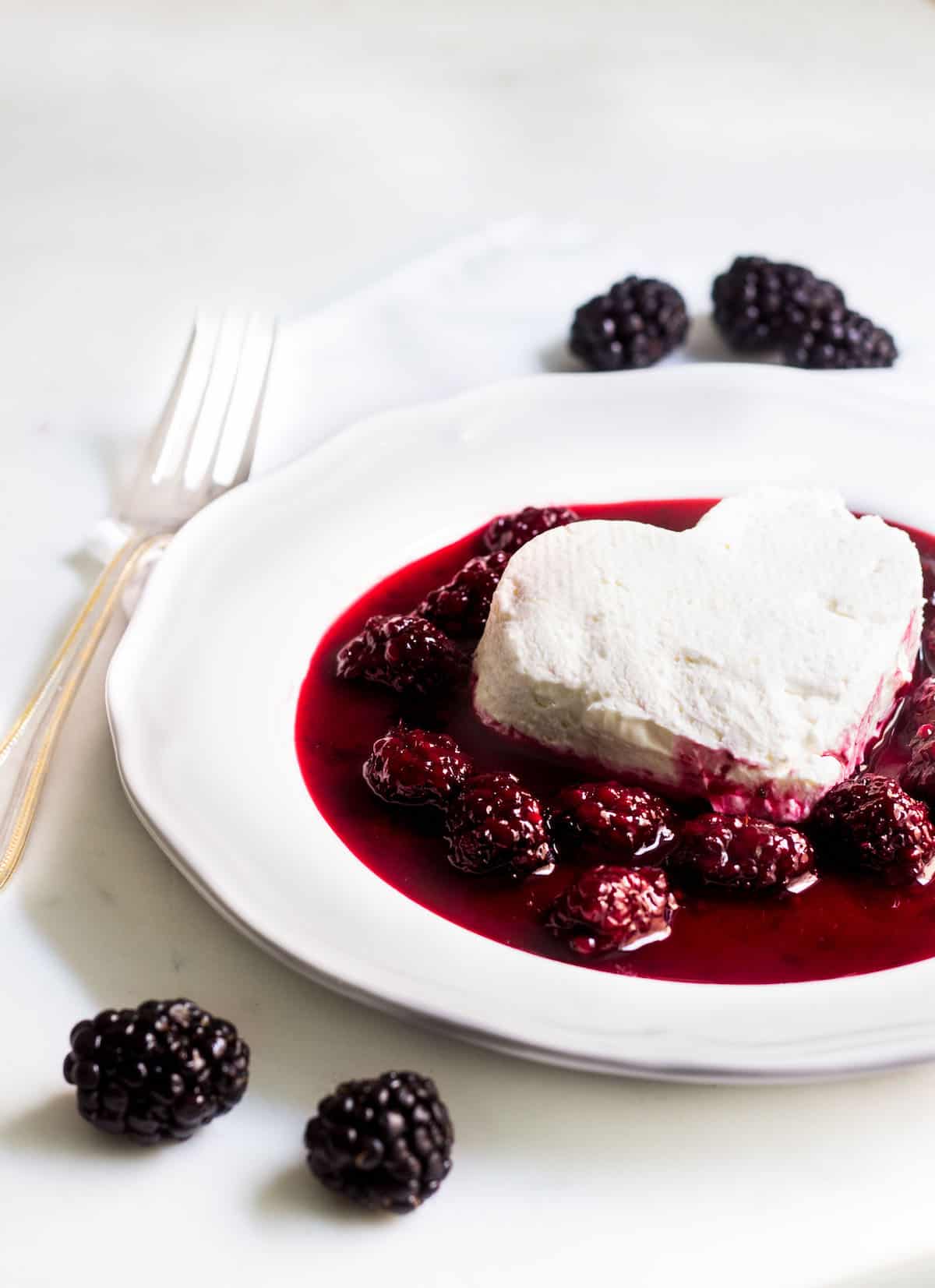 Coeur a la creme: A creamy, rich French dessert served with blackberry sauce. Perfect for Valentine's Day or special occasions! Recipe via MonPetitFour.com