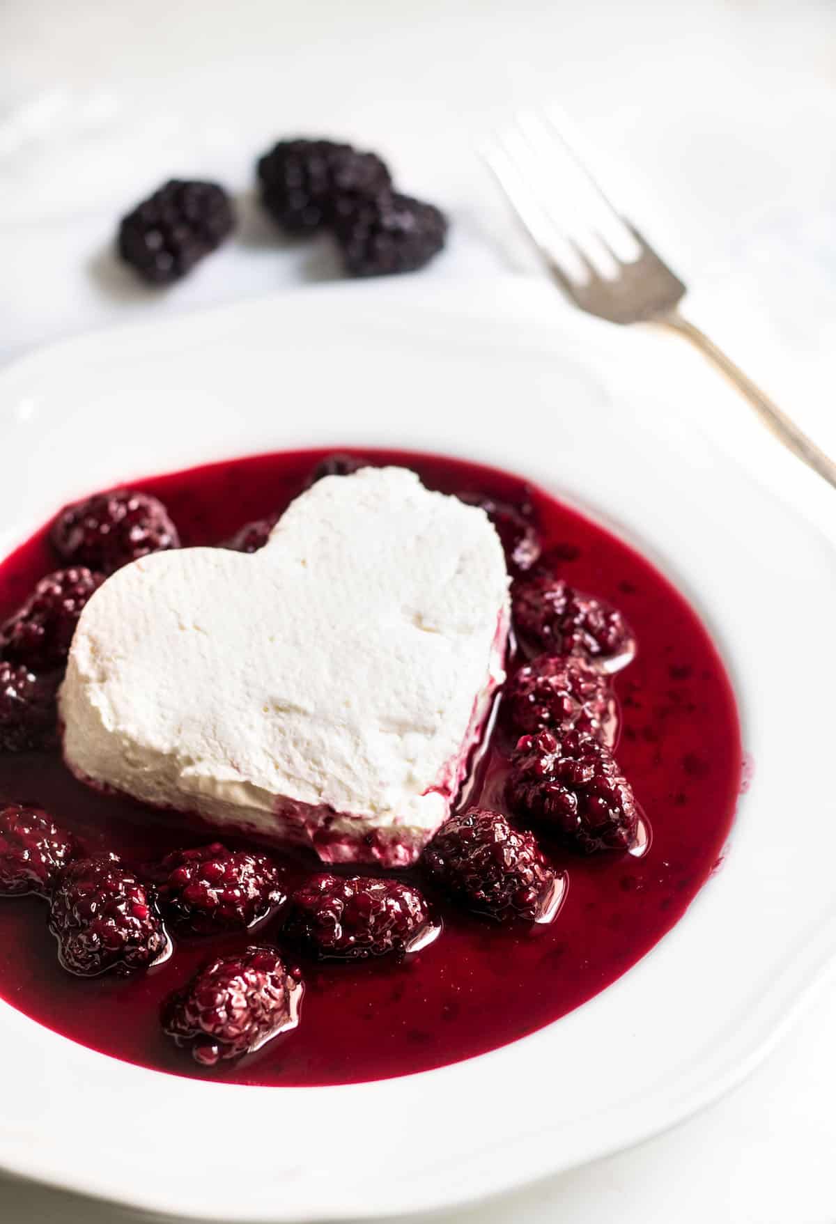 Coeur a la creme: A creamy, rich French dessert served with blackberry sauce. Perfect for Valentine's Day or special occasions! Recipe via MonPetitFour.com