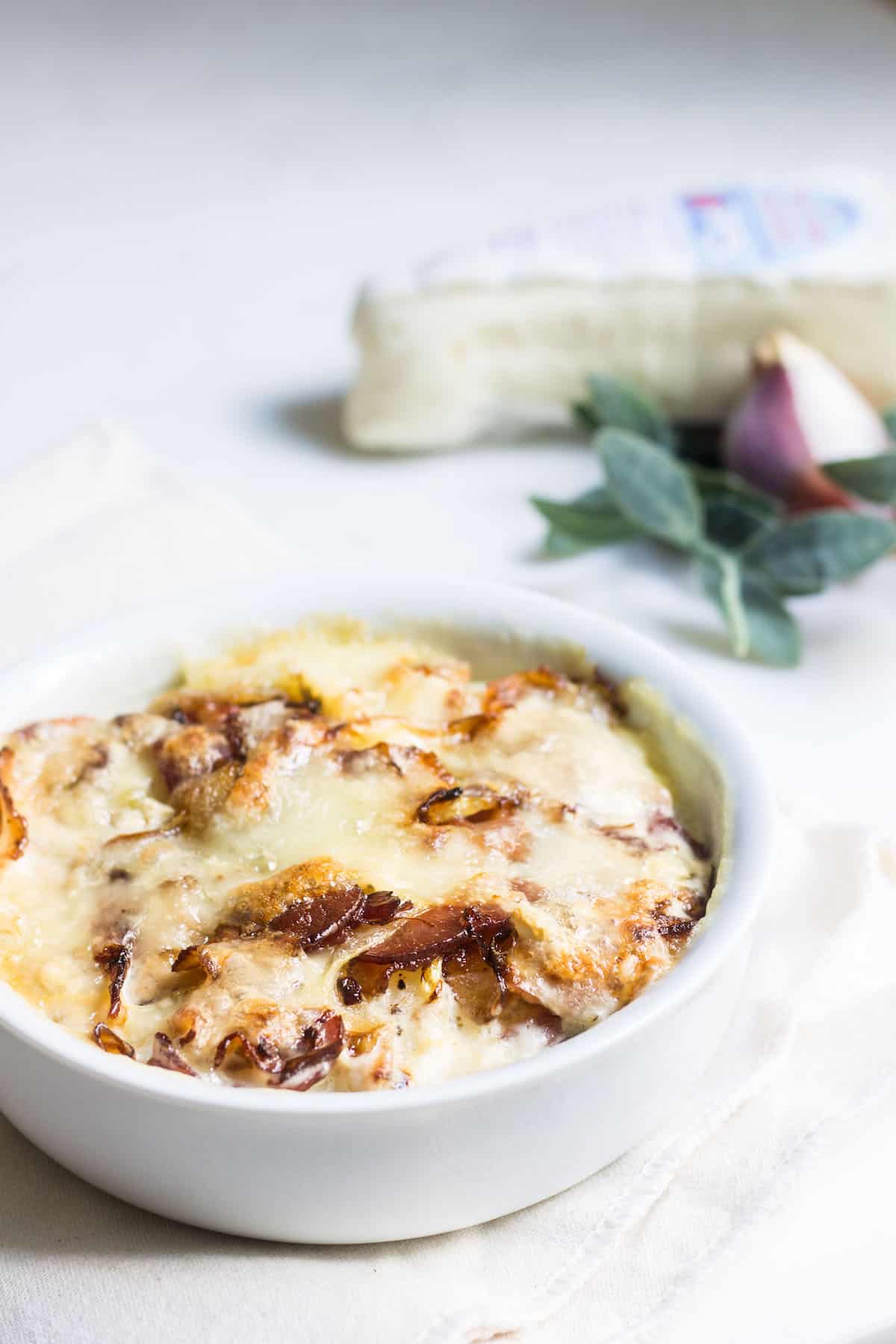 Tartiflette: the ultimate cheesy potato bake with bacons and creamy brie! Recipe via MonPetitFour.com