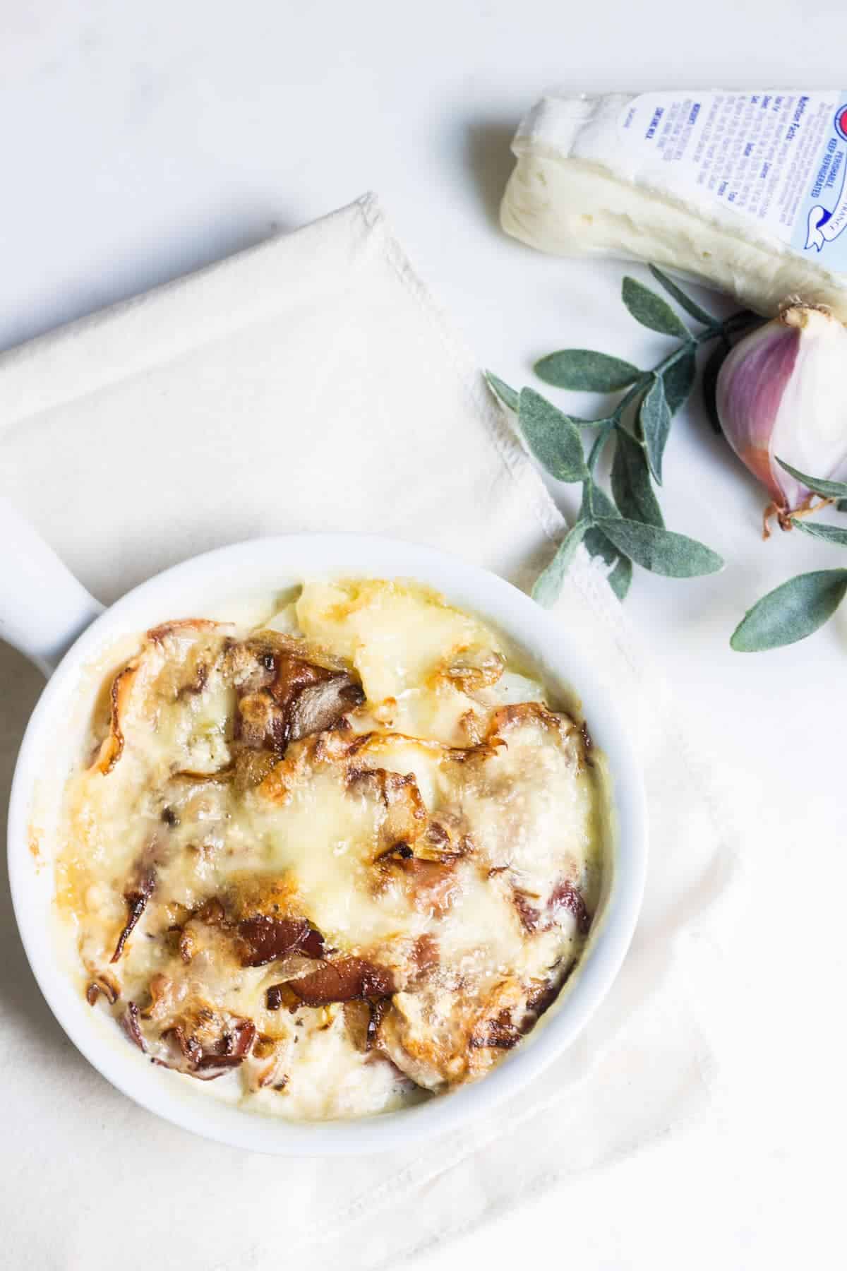 Tartiflette: the ultimate cheesy potato bake with bacons and creamy brie! Recipe via MonPetitFour.com