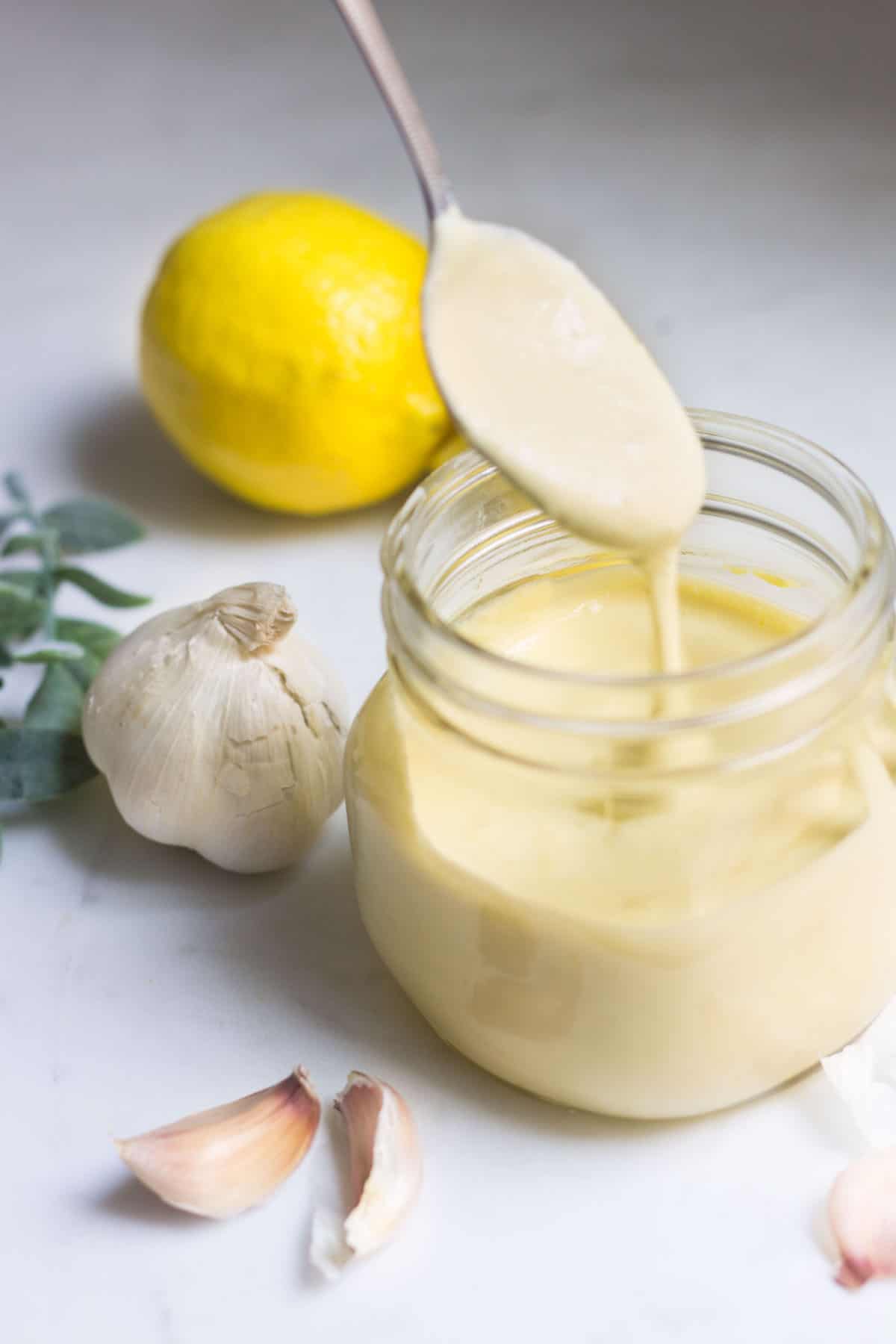 Aioli: a creamy garlic mayonnaise that's perfect on sandwiches, burgers, fries, and more! Recipe via MonpetitFour.com