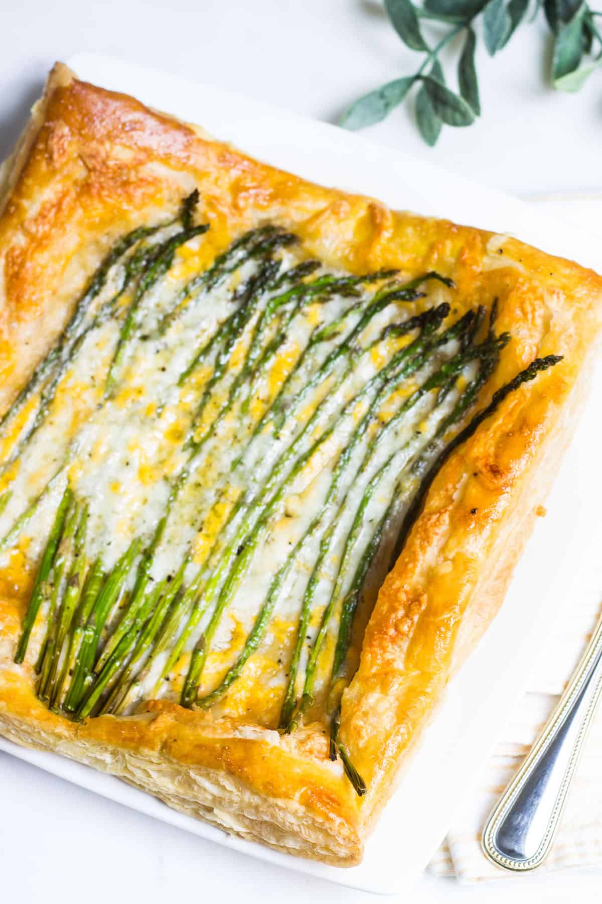 Asparagus Tart: a quick and simple appetizer or lunch using puff pastry, fresh asparagus, and cheese. Recipe via MonPetitFour.com