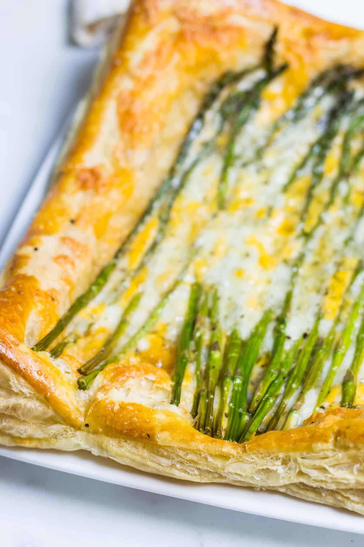Asparagus Tart: a quick and simple appetizer or lunch using puff pastry, fresh asparagus, and cheese. Recipe via MonPetitFour.com