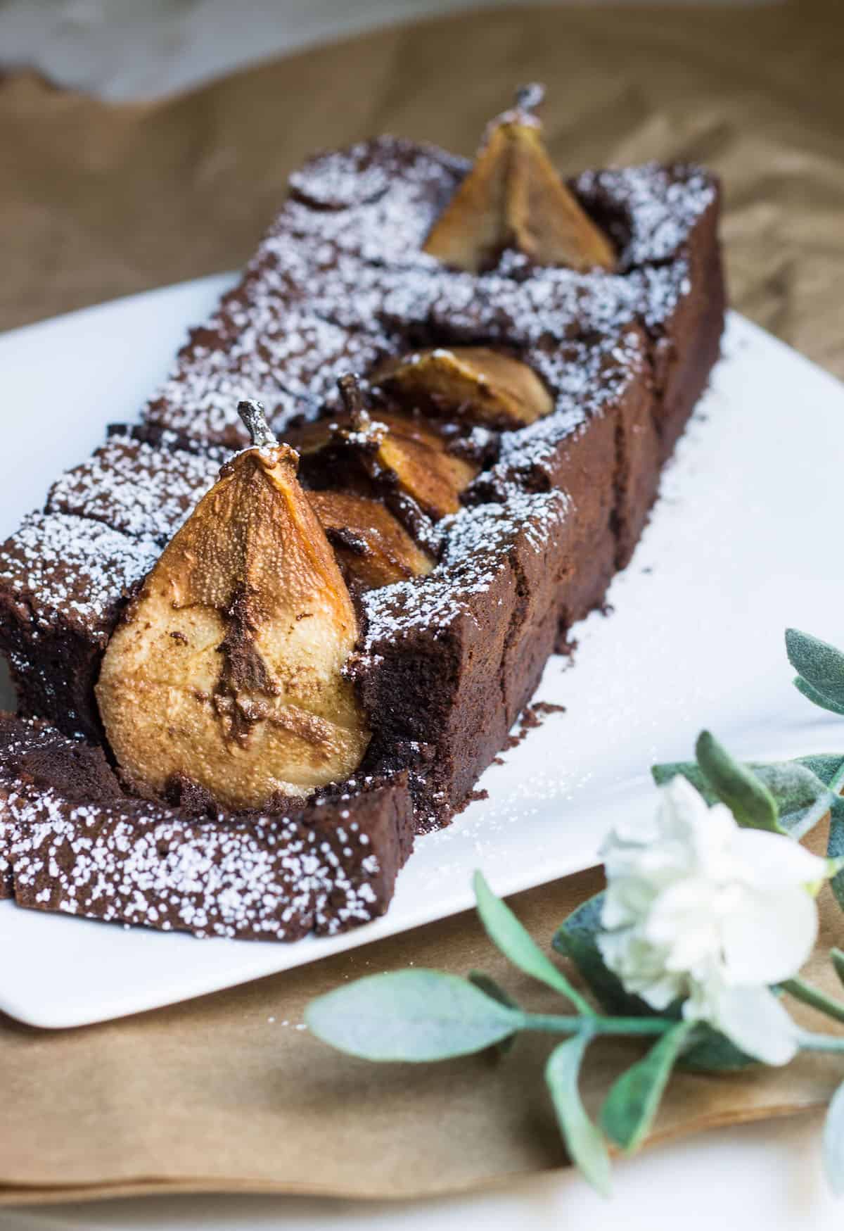 Chocolate Pear Cake: sweet Anjou pears dunked in a rich and fudgy chocolate cake. Recipe via MonPetitFour.com