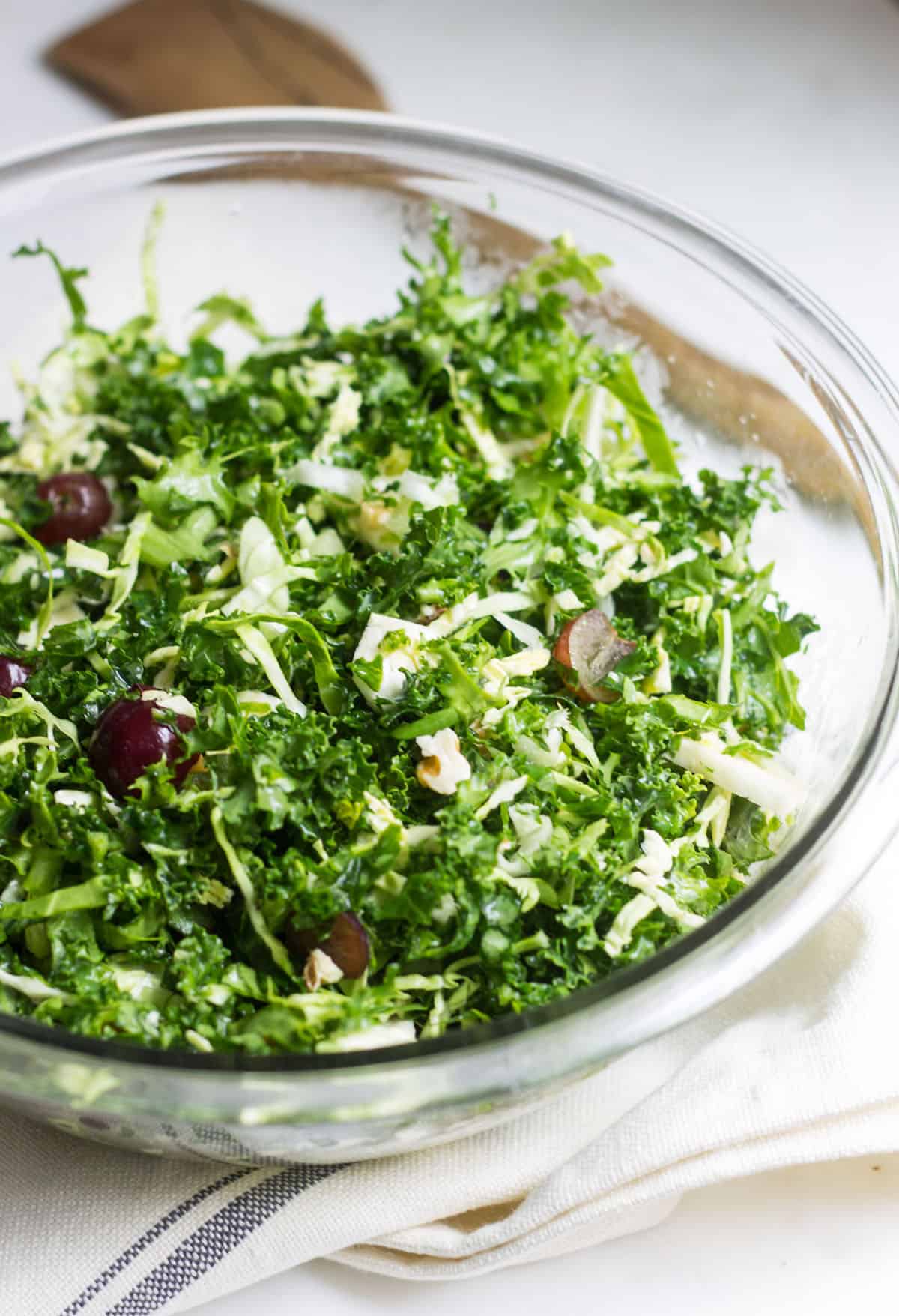 Kale Brussels Sprout Salad: A delicious & healthy, go-to salad to enjoy on its own or with your favorite entrée! Recipe via MonPetitFour.com