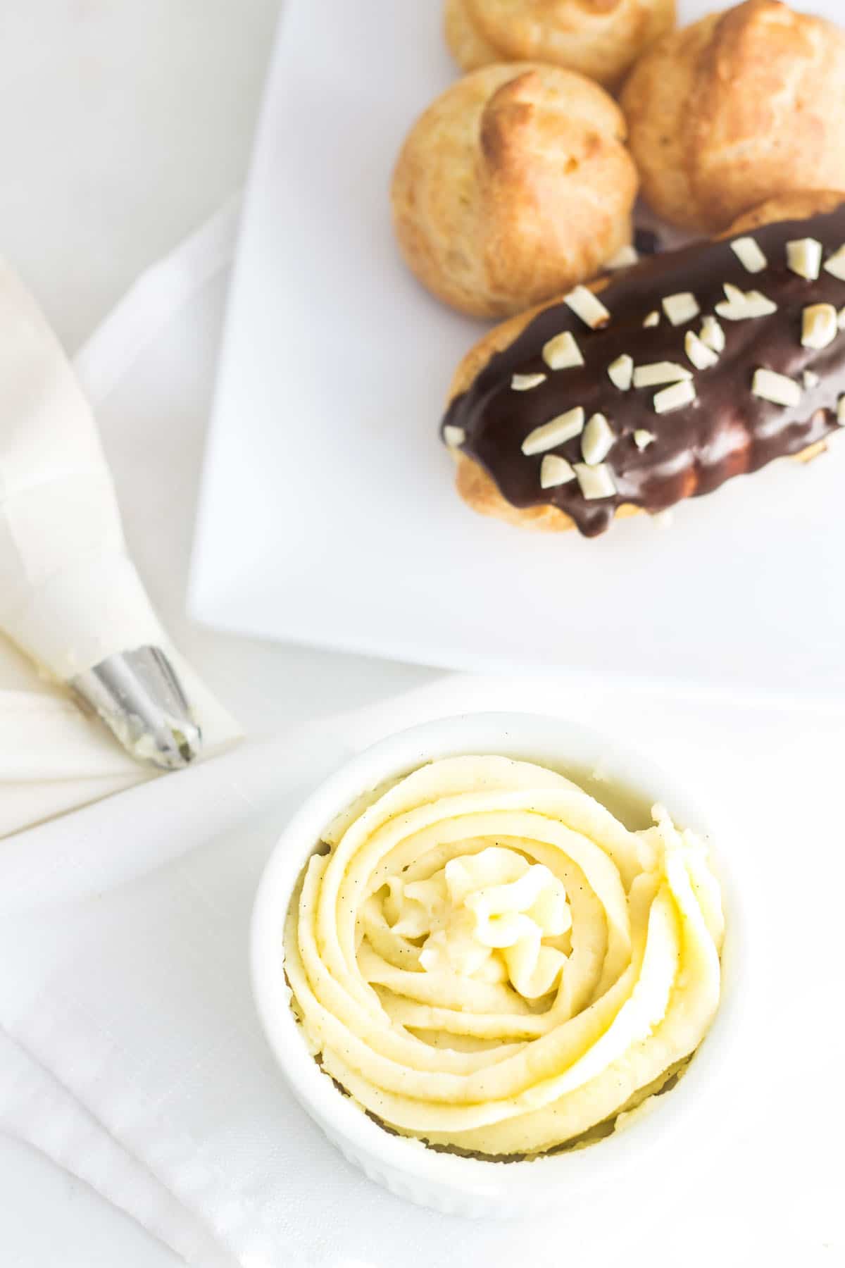 Pastry Cream (Creme Patissiere): a simple and creamy filling for tarts, cakes, and French pastries like eclairs and profiteroles! Recipe via MonPetitFour.com