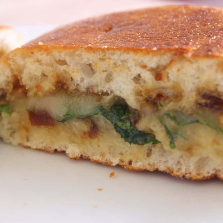 Grilled Brie Cheese close up shot of sandwich half