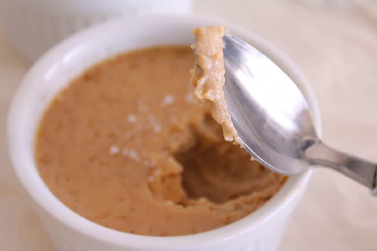 Pots de Creme Recipe (salted caramel) close-up shot of spoon in digging into pudding