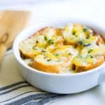 French Onion Soup: a classic & easy bistro soup made with caramelized onions, beef broth, French bread, and melted cheese. Recipe via MonPetitFour.com