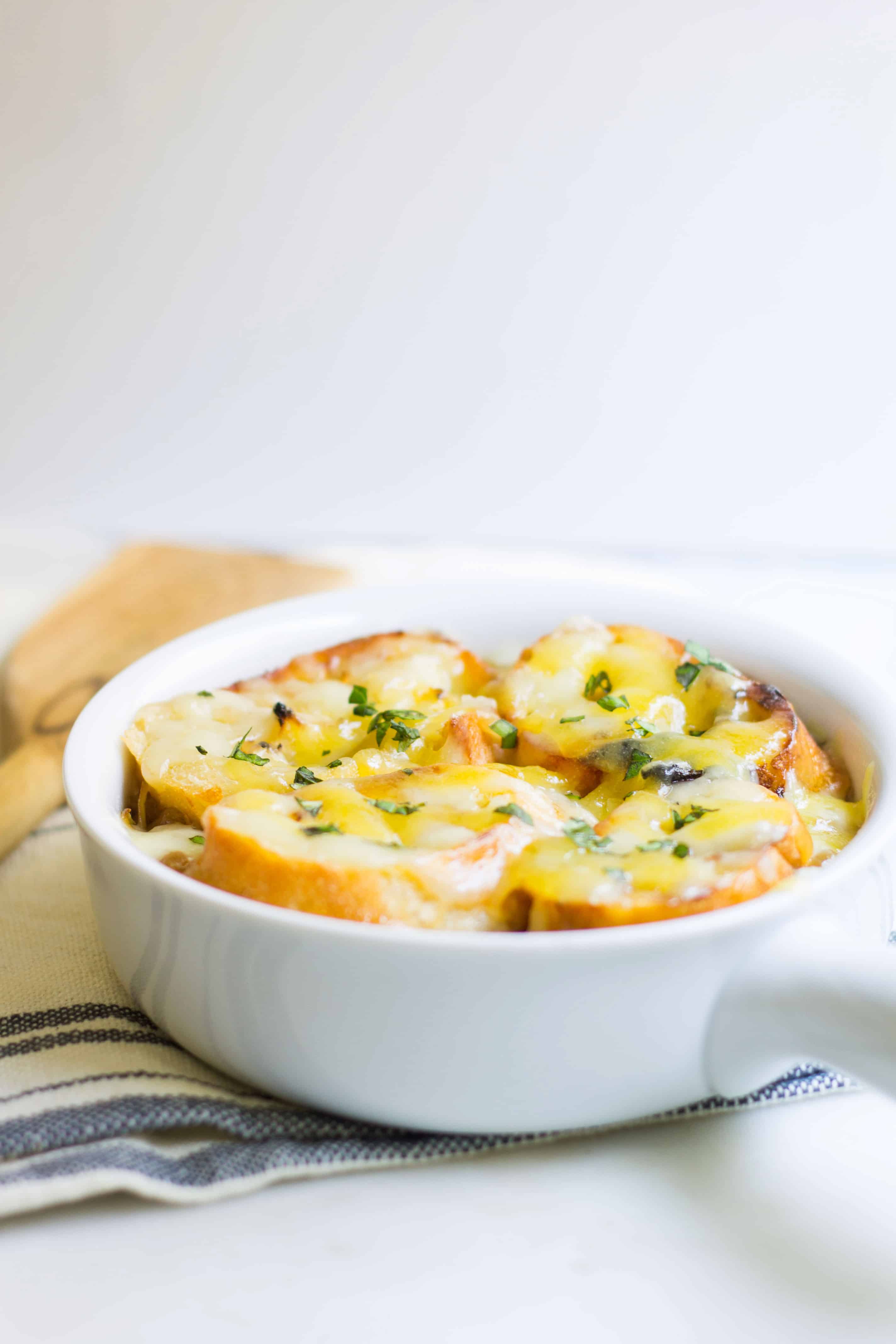 French onion soup cheese melted and bubbly on top of croutons