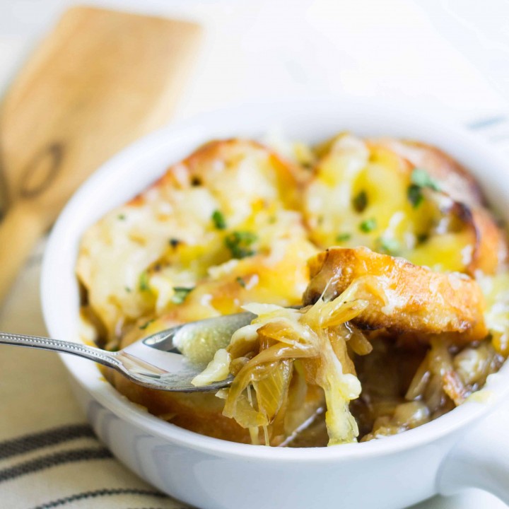 French Onion Soup: a classic & easy bistro soup made with caramelized onions, beef broth, French bread, and melted cheese. Recipe via MonPetitFour.com