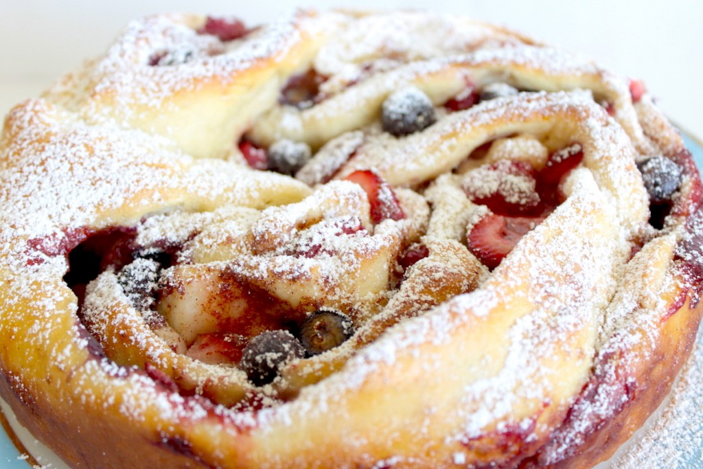 close-up image of braided bread with berry filling image