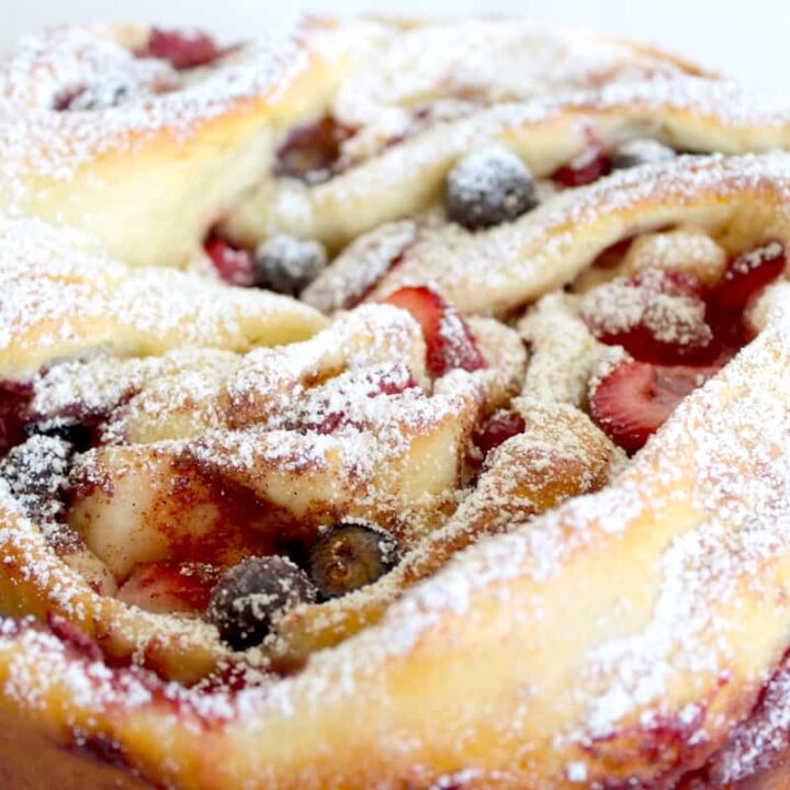 close-up image of braided bread with berry filling image