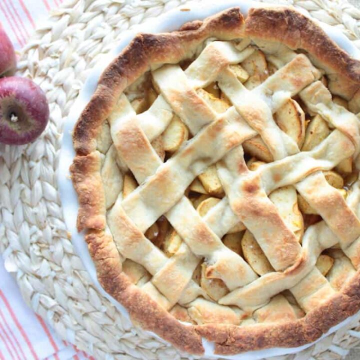 easy apple pie recipe in a pie dish next to apples