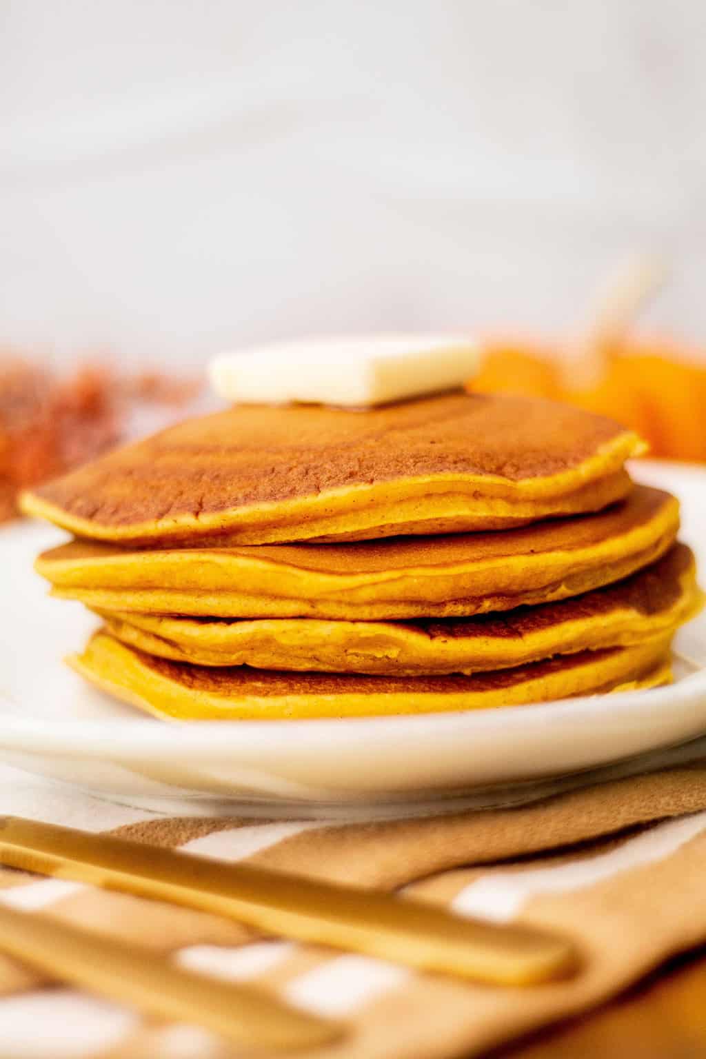 pumpkin spice pancakes stacked on top of each other image