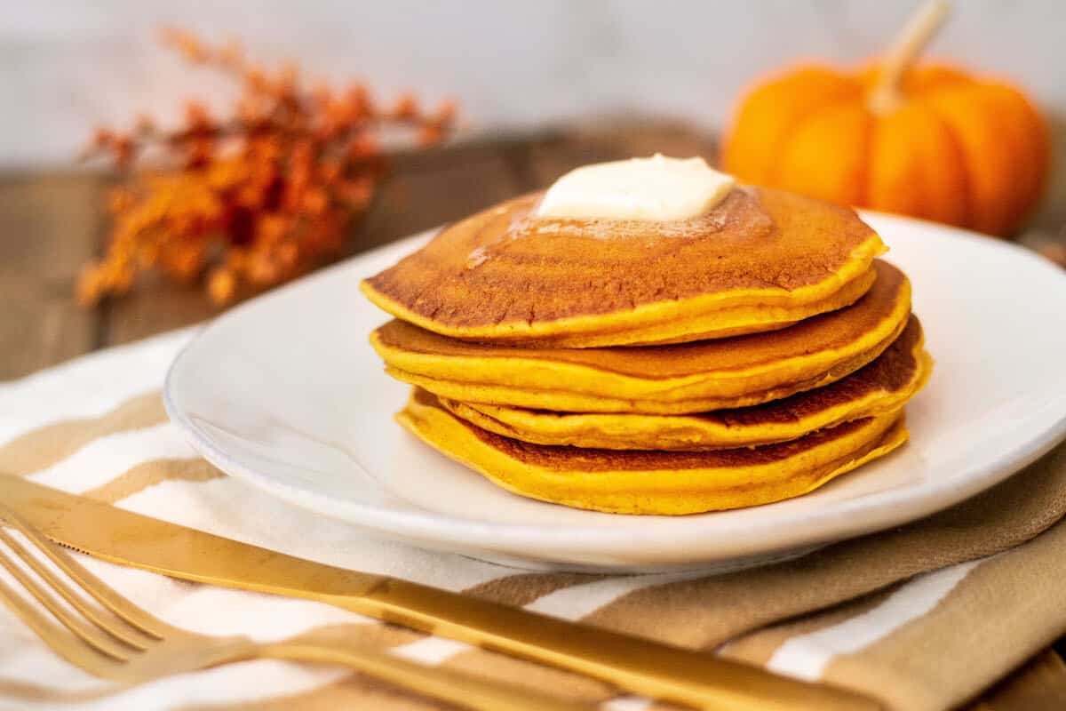 pumpkin spice pancakes stack with butter image