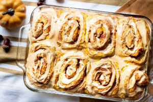 pumpkin cinnamon rolls in a baking pan image