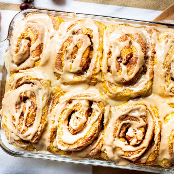 pumpkin cinnamon rolls in a baking pan image