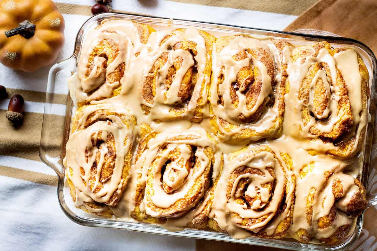 pumpkin cinnamon rolls in a baking pan image