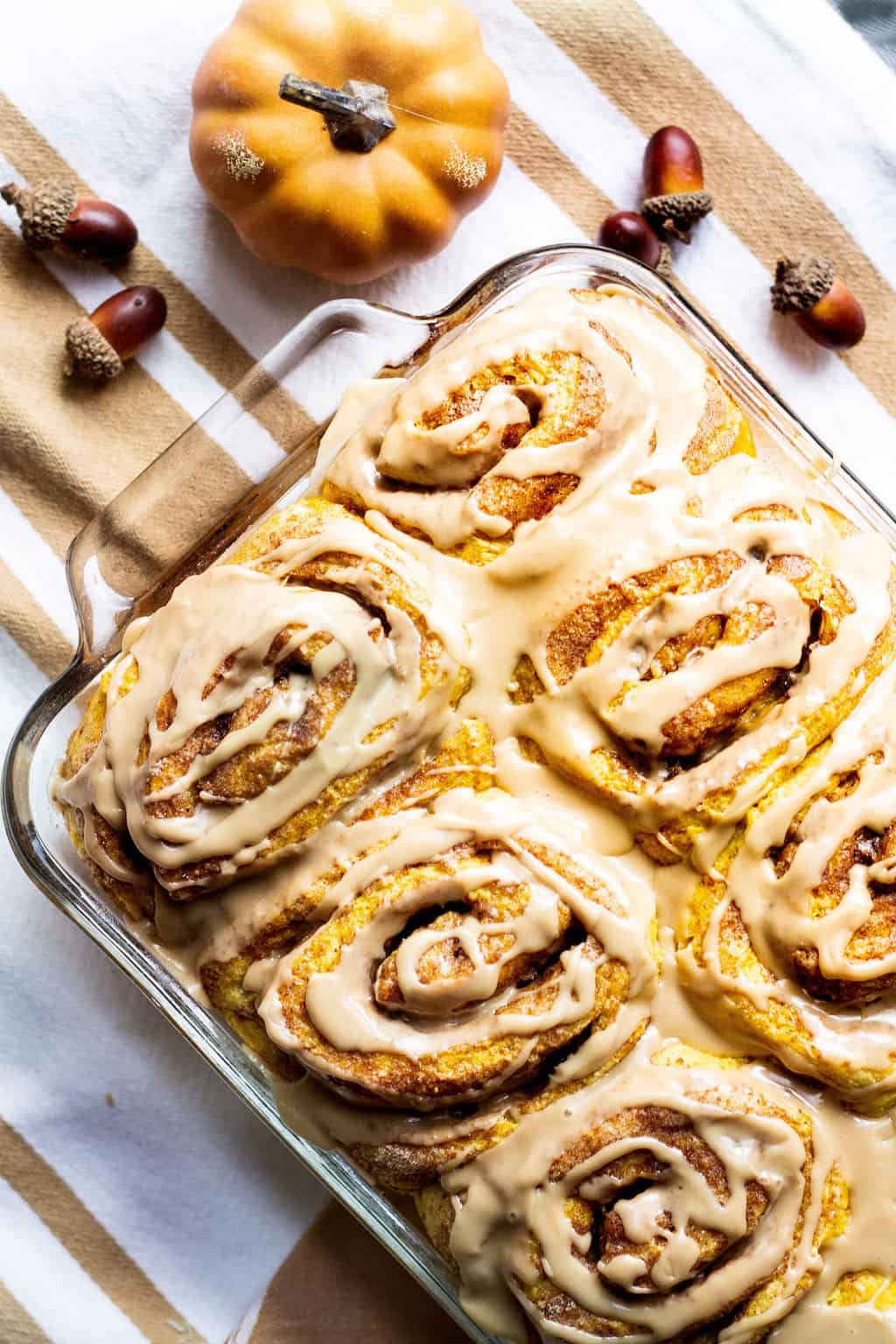 pumpkin cinnamon rolls recipe in a pan portrait image