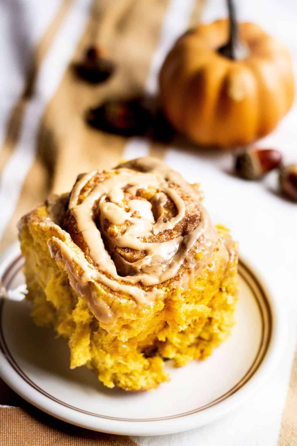 pumpkin cinnamon roll on a plate image