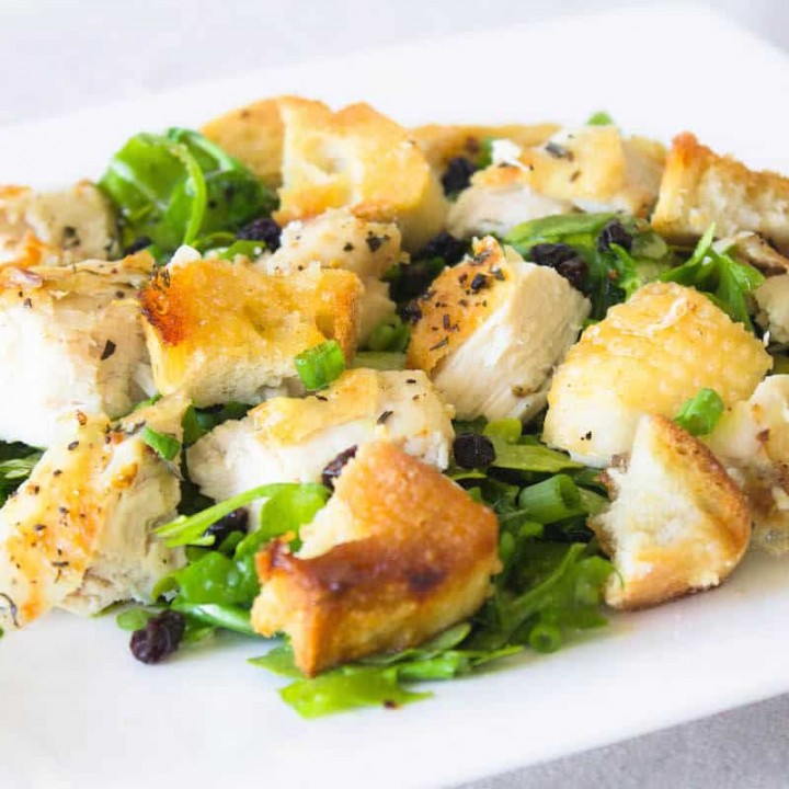 roast chicken on arugula with bread croutons image