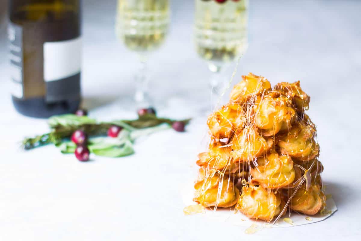 croquembouche tower of cream puffs with spun sugar - featured image