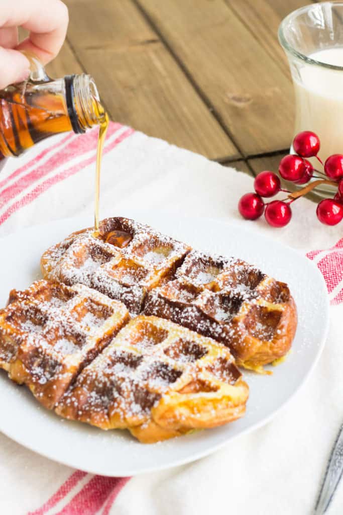 Cinnamon Syrup being poured into eggnog waffles
