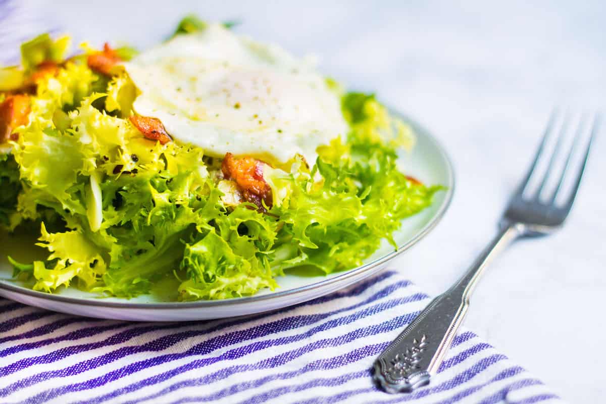 Frisee aux Lardons: Endive salad with bacon, a fried egg, and a light vinaigrette. Recipe via MonPetitFour.com