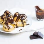 Profiteroles Recipe on a plate with warm chocolate sauce