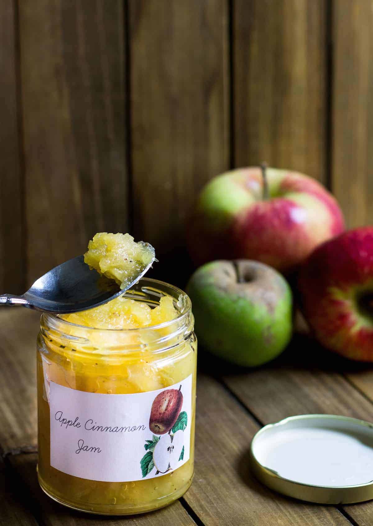 Apple Jam Recipe being scooped up out of a jar