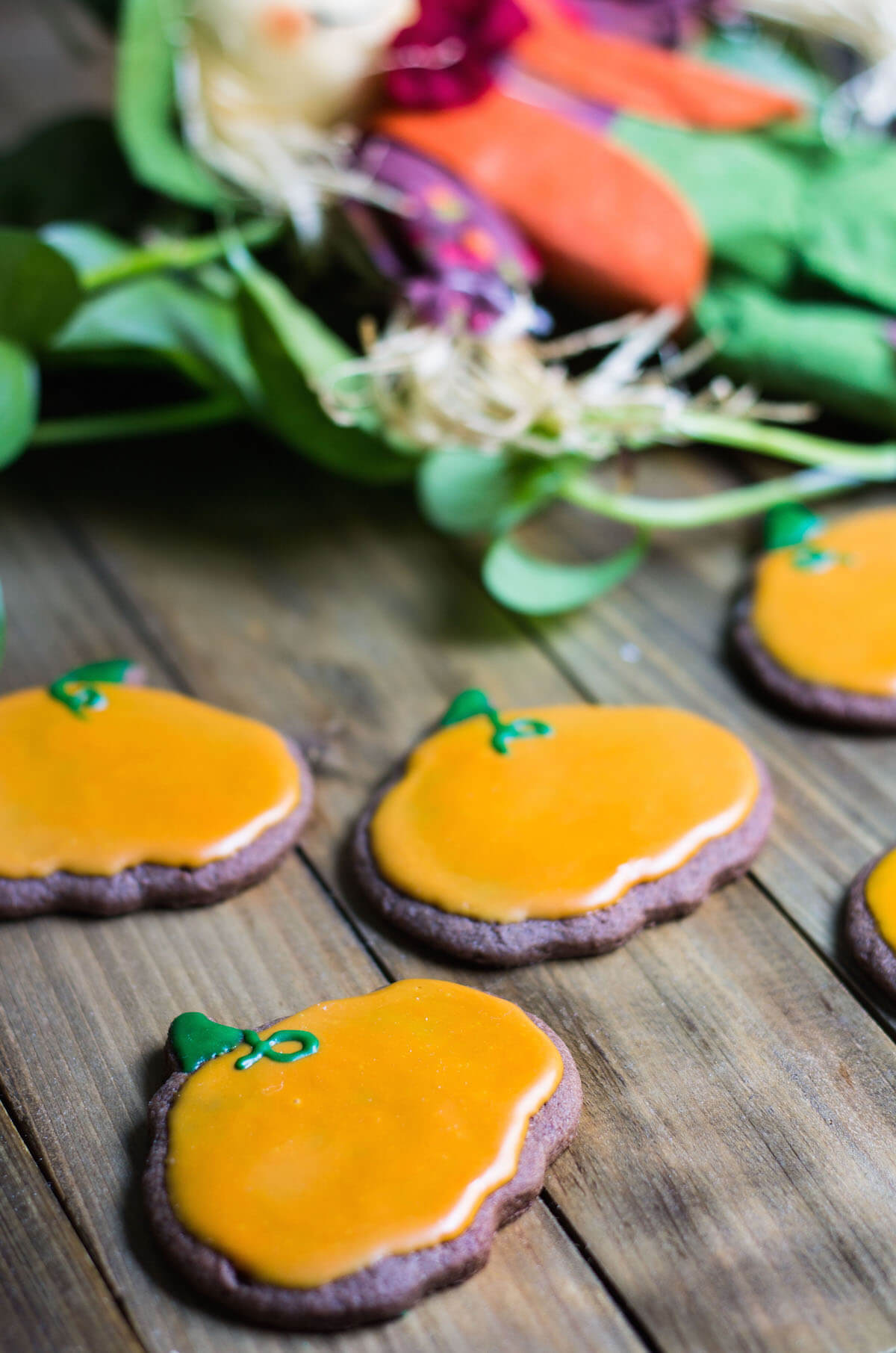 Halloween Cookies decorated as pumpkins with royal icing