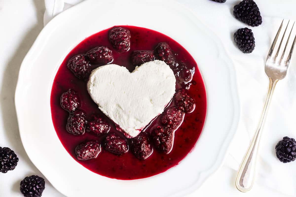 Coeur a la creme: A creamy, rich French dessert served with blackberry sauce. Perfect for Valentine's Day or special occasions! Recipe via MonPetitFour.com