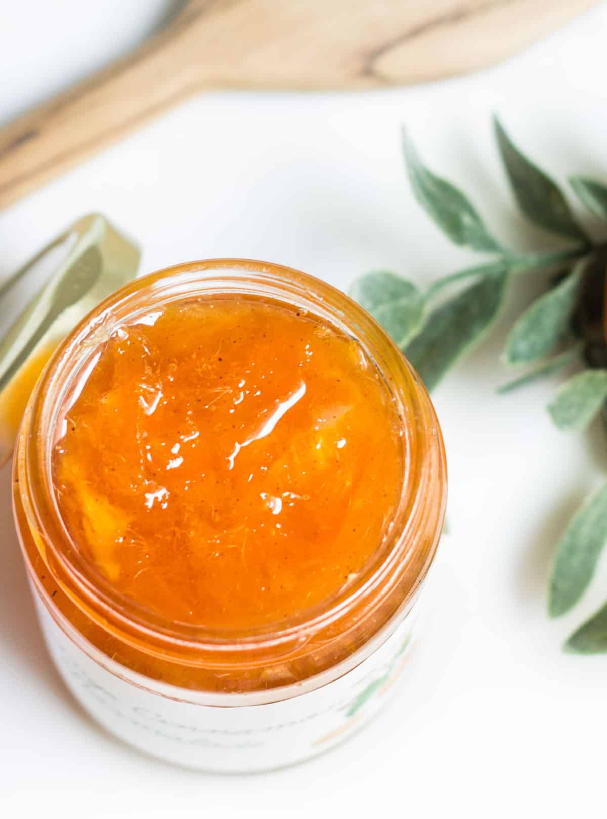 orange jam in a jar close up image