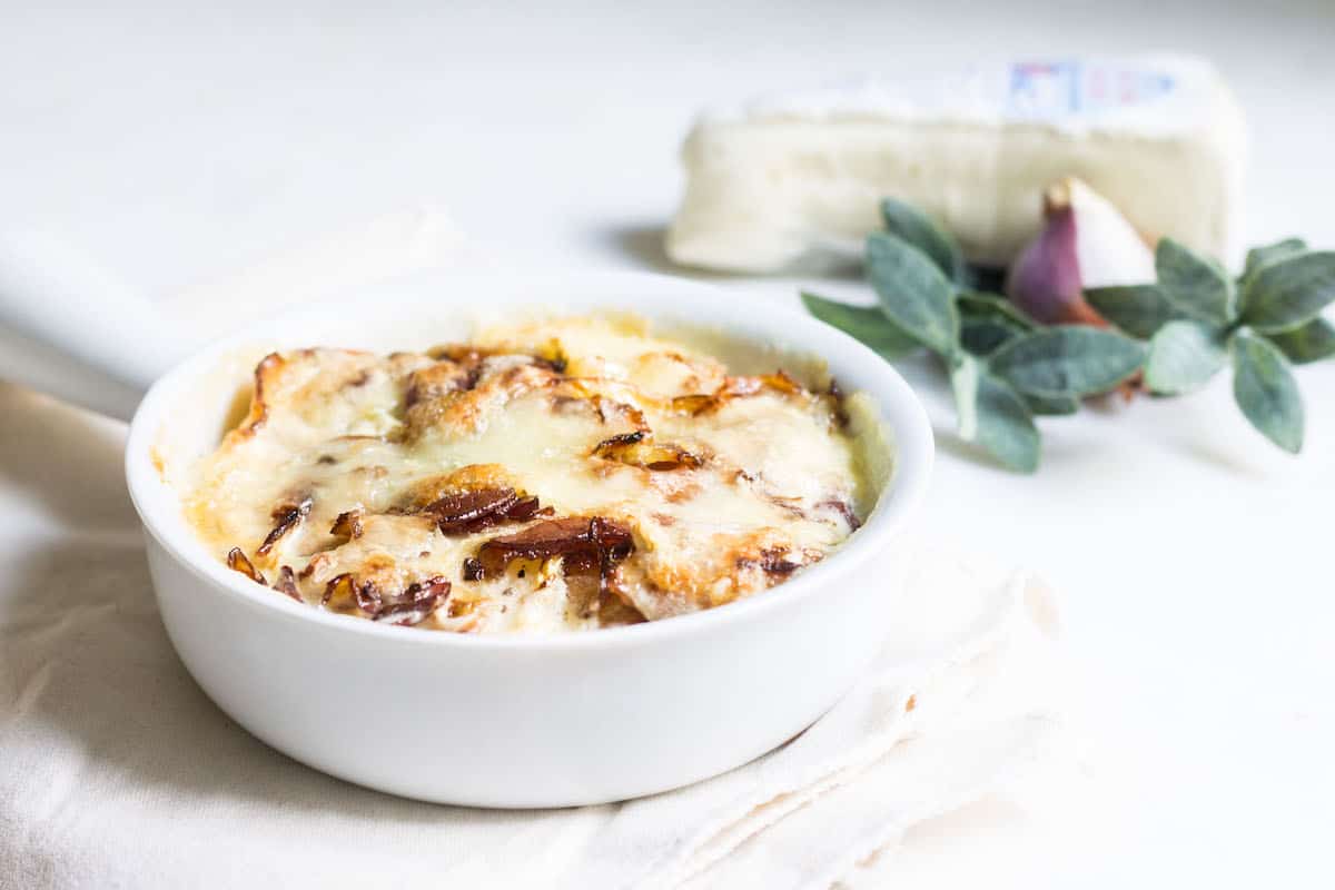 Tartiflette: the ultimate cheesy potato bake with bacons and creamy brie! Recipe via MonPetitFour.com