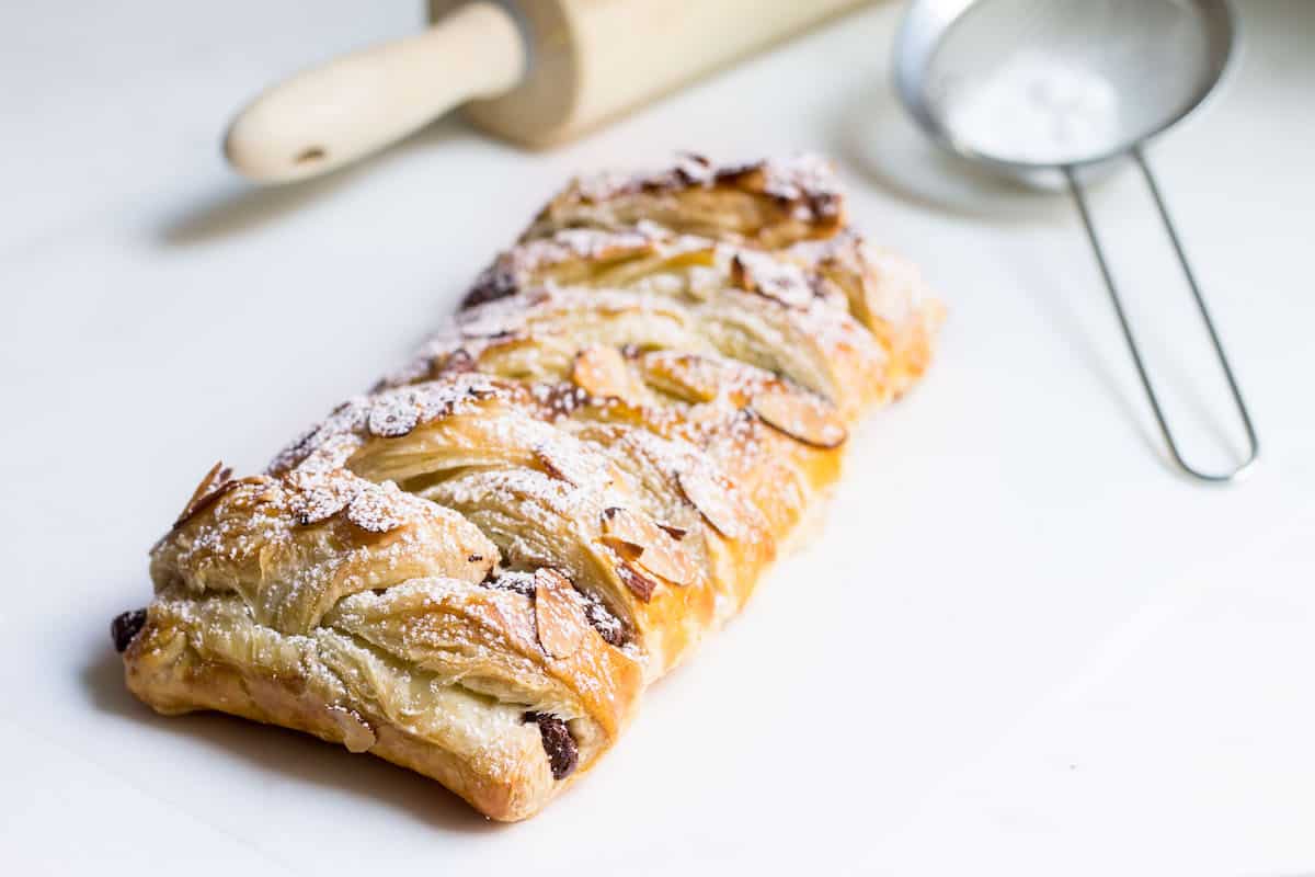 Chocolate Pastry Braid: 3-Ingredient Dessert! Gooey chocolate nestled inside puff pastry and topped with sliced almonds. Recipe via MonPetitFour.com