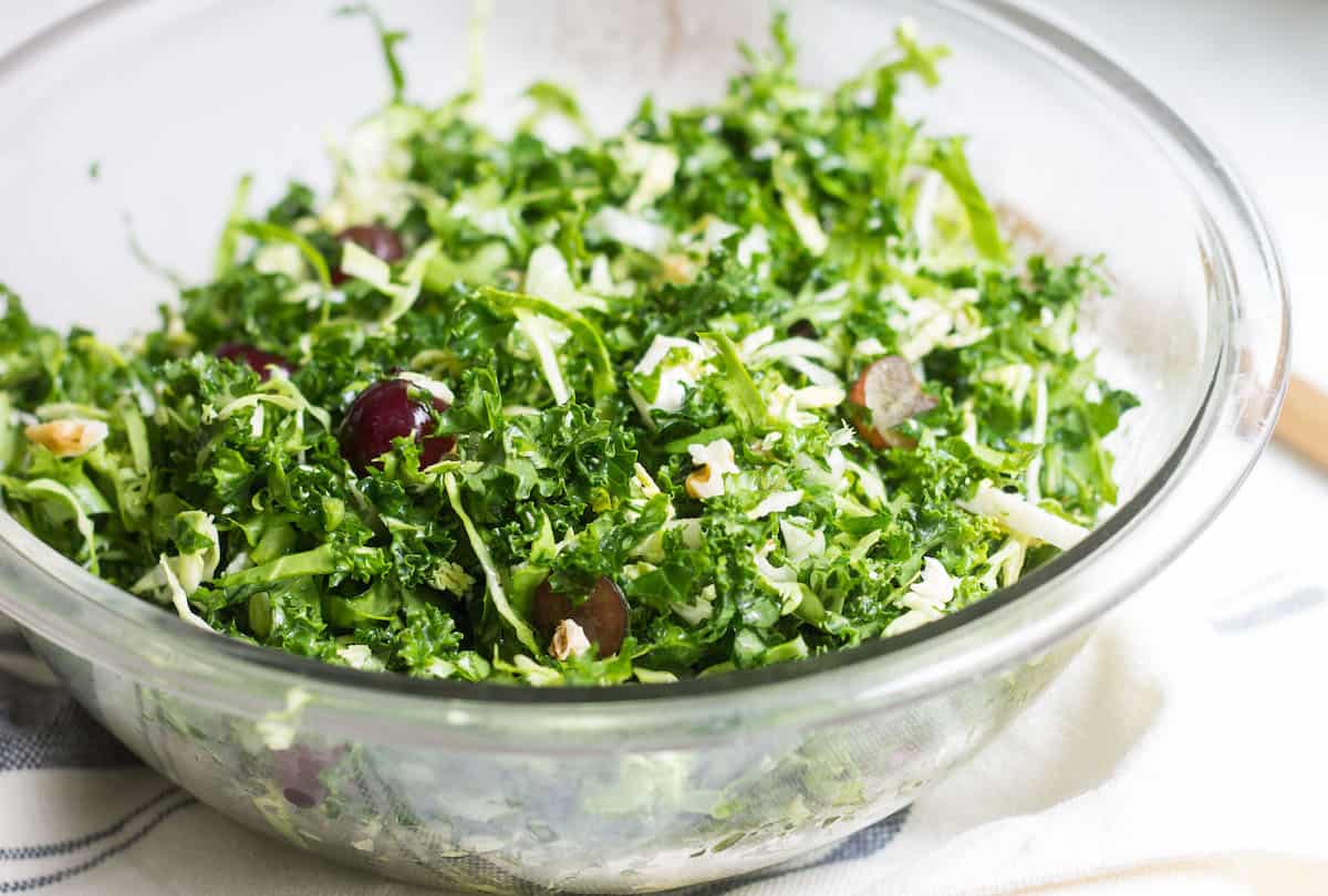 Kale Brussels Sprout Salad: A delicious & healthy, go-to salad to enjoy on its own or with your favorite entrée! Recipe via MonPetitFour.com