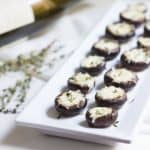 Garlic Stuffed Mushrooms: crimini mushrooms stuffed with garlic butter and parmesan cheese. Perfect appetizer or side dish! French recipe via MonPetitFour.com
