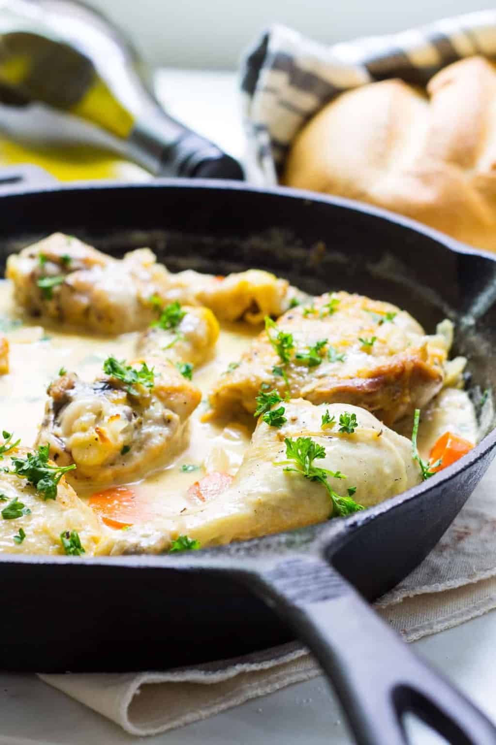 classic french chicken in white wine sauce close up image