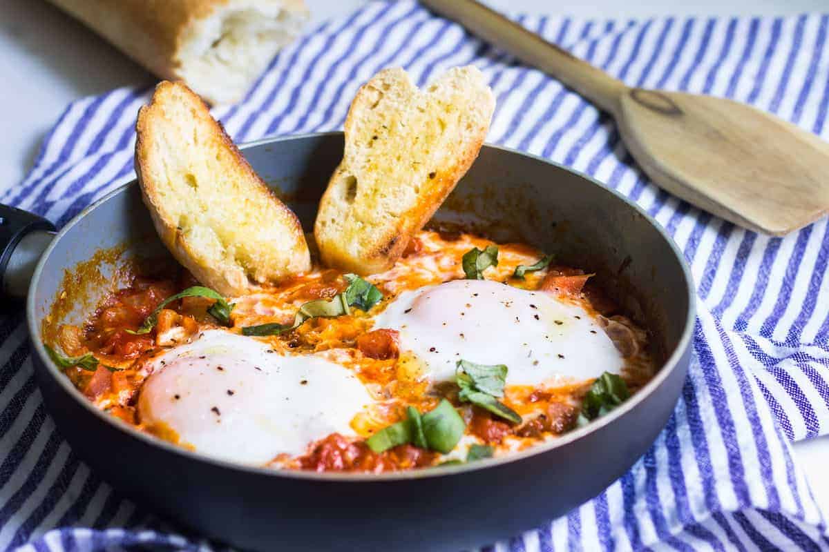 Eggs in Tomato Sauce: a quick, French dinner made with minimal ingredients. Recipe via MonPetitFour.com