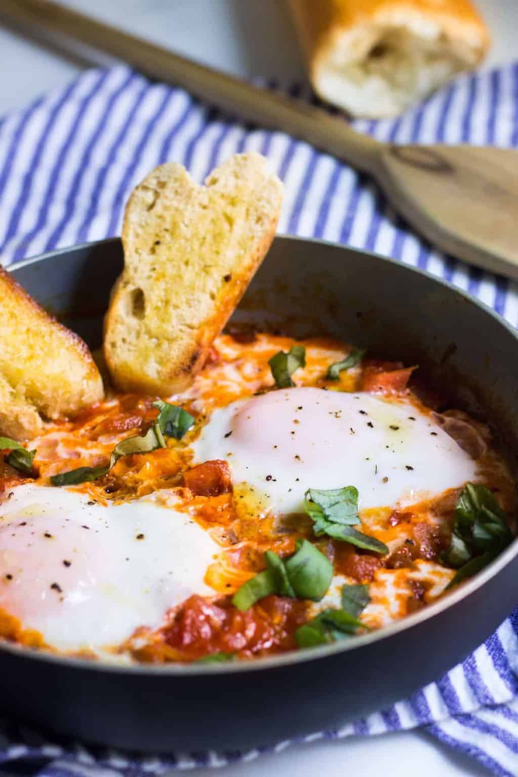 Eggs in Tomato Sauce: a quick, French dinner made with minimal ingredients. Recipe via MonPetitFour.com