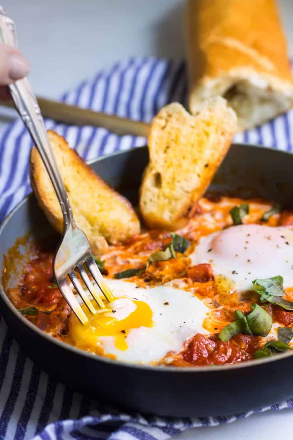 Eggs in Tomato Sauce: a quick, French dinner made with minimal ingredients. Recipe via MonPetitFour.com