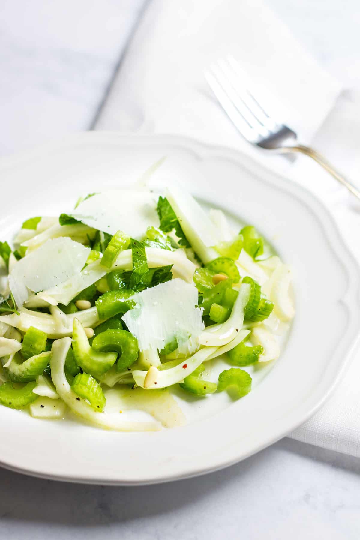 Fennel Salad: a light and refreshing mix made up of fennel, celery, pine nuts, and parmesan shavings. Recipe via MonPetitFour.com