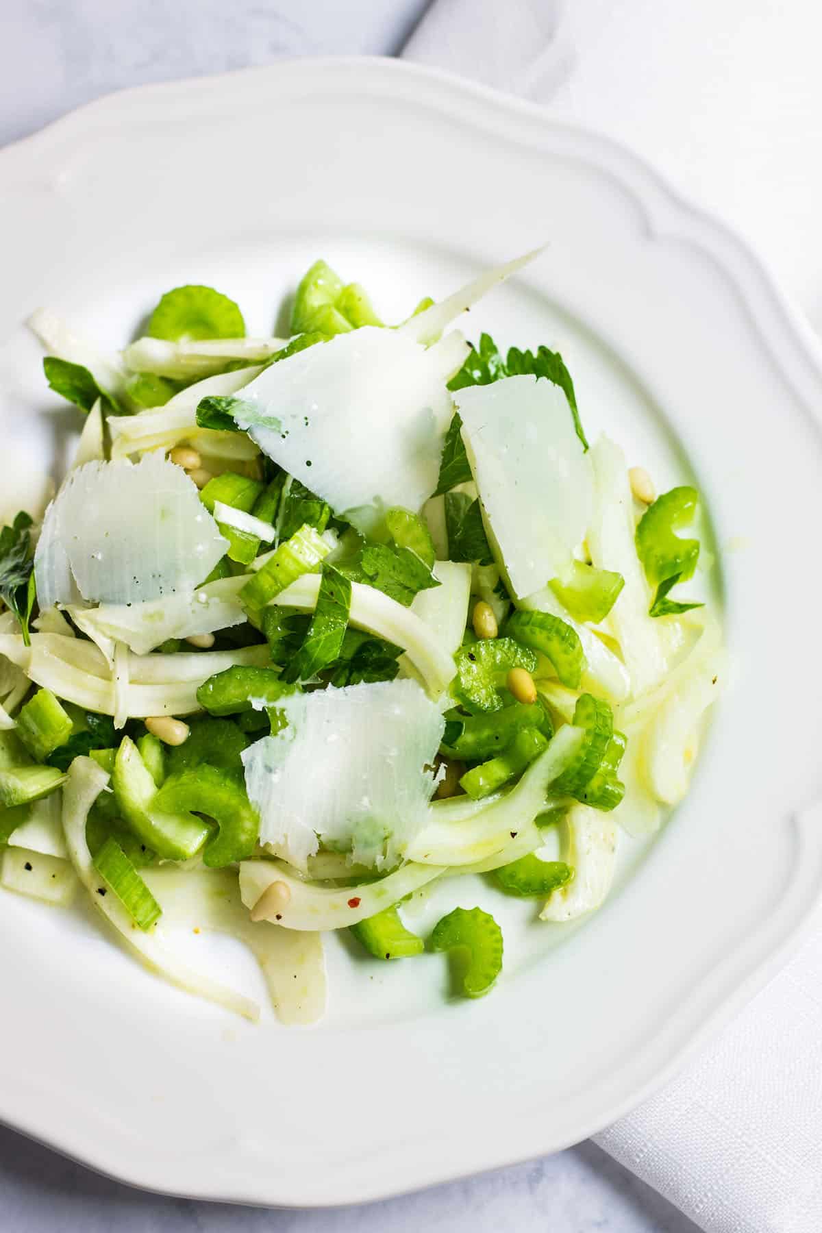 Fennel Salad: a light and refreshing mix made up of fennel, celery, pine nuts, and parmesan shavings. Recipe via MonPetitFour.com