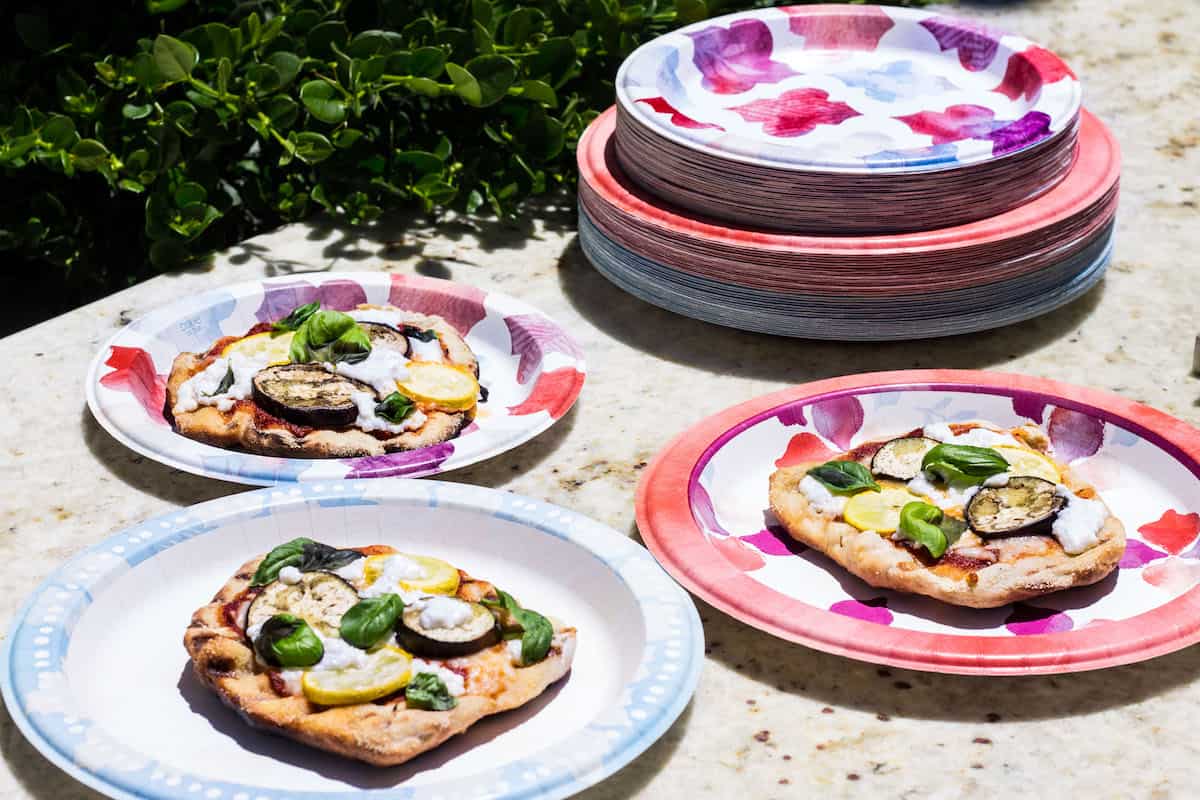 Grilled Pizza: personal size pizza made on the grill and topped with summer veggies! Recipe via MonPetitFour.com
