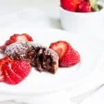 Molten Chocolate Cake: decadent little chocolate cakes with surprise gooey centers! Recipe via MonPetitFour.com