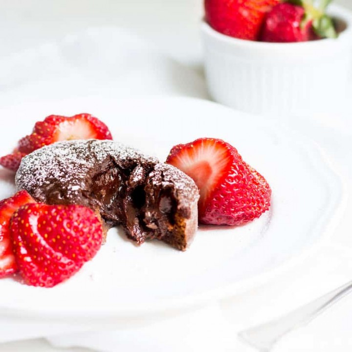 Molten Chocolate Cake: decadent little chocolate cakes with surprise gooey centers! Recipe via MonPetitFour.com