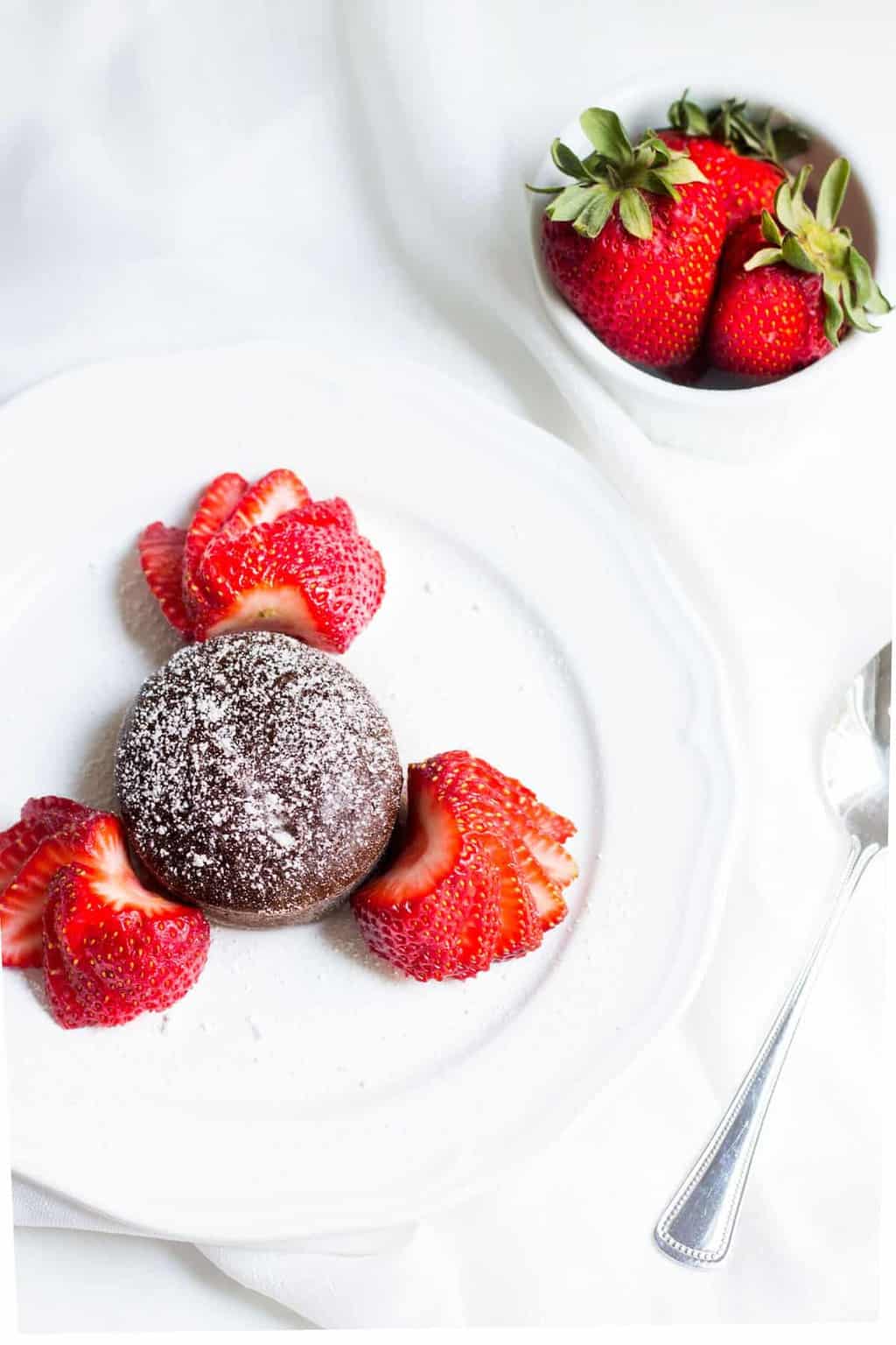 Molten Chocolate Cake: decadent little chocolate cakes with surprise gooey centers! Recipe via MonPetitFour.com