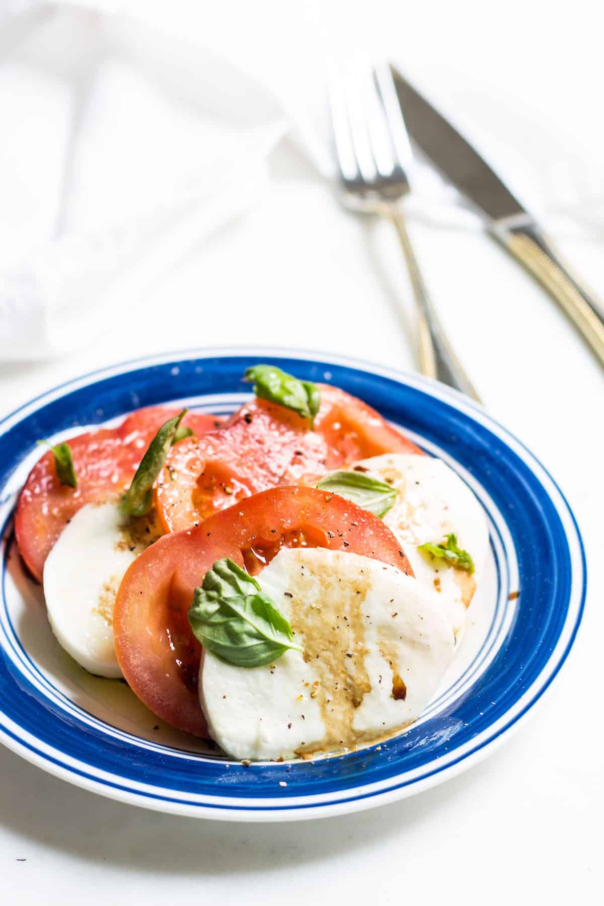 Tomato Mozzarella Salad with fresh basil! Recipe via MonPetitFour.com